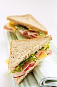 Turkey ham, cheese, radish and rocket in a sandwich