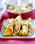 Omelette rolls with spicy rice filling
