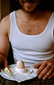 Man eating breakfast egg