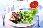Beef steak with broccoli florets and green salad