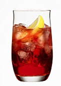 A glass of Campari with lemon and ice cubes