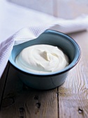 Fresh sour cream in a small bowl