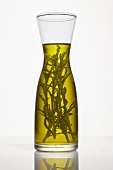 Oil with herbs in a carafe