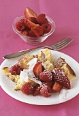Pancake pieces with coconut, strawberries and raspberries