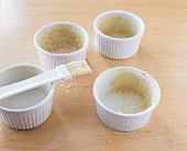 Coating soufflé dishes with crumbs
