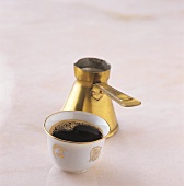 Turkish coffee in cup and pot