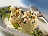 Cauliflower with herb sauce, diced ham, and egg