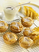 Macadamia cream tarts with glacé icing