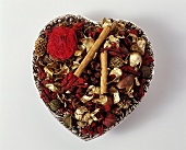 Heart with dried flowers and cinnamon sticks
