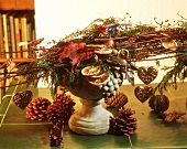 Christmas arrangement of natural materials & glass birds