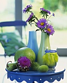 Autumn decoration: ornamental gourds, artichoke flower & asters