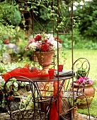 Arrangement of dahlias in a terracotta goblet