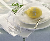Distinctive place-card: lemon with name and tulle