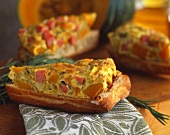Piece of vegetable quiche with crusty white bread