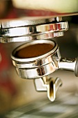 Filter holder being fitted on espresso machine