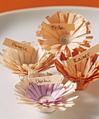 Four place-cards in shape of flowers