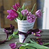 Pink tulips in a sheet of music