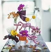 A pyramid of glasses and flowers