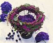 Wreath of purple loosestrife & Russian vine around hydrangea