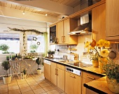 Kitchen with herb pots and bouquet of poppies