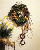 Autumn wreath of birch twigs, onions, ivy etc.