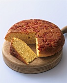 Polenta cake with pancetta, a piece cut (Aga Cooking)