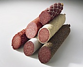 A pyramid of different types of salami