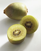 Kiwi fruits (Actinidia chinensis), variety Gold, whole & halved