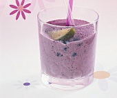 Blueberry shake with lime wedge