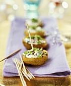 Small baked potatoes with sour cream
