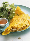 Banh xeo (rice pancakes with chicken and shrimps, Vietnam)