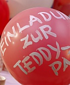 Invitation to teddy party on balloon