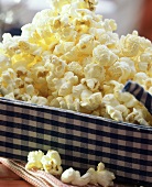 Popcorn in a blue and white cloth basket