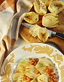 Fennel with diced tomatoes and fennel leaves