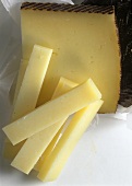 Manchego (Spanish hard cheese) in piece and strips