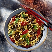 Chinese noodle stir-fry with meat, peppers, mangetouts
