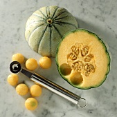 Half a Cantaloupe with a Melon Scoop