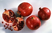 Several Pomegranates; One Cut in Half