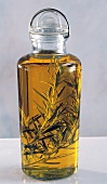 A Bottle of Olive Oil Flavored with Rosemary