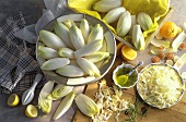 Chicory, whole & sliced, bowl of oil, oranges, lemons