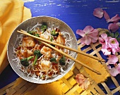 Crispy noodles with sweet and sour fish and broccoli