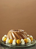 Chocolate blancmange with cream rosettes and melon balls