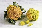 Two romanesco broccolis with individual small florets