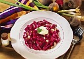 Red ribbon noodles with beetroot & spring onions