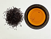 Indian Assam tea; tea leaves and infusion of tea 