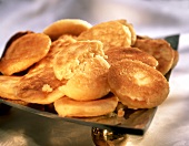 Crumpets (round yeast cakes with holes)