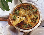 Potato pie with shallots and marjoram leaves