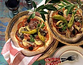 Spicy anchovy and ham pizza with chili and olives