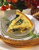 A piece of salmon pie with spinach and dill