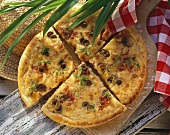 Hearty potato pizza with olives and marjoram